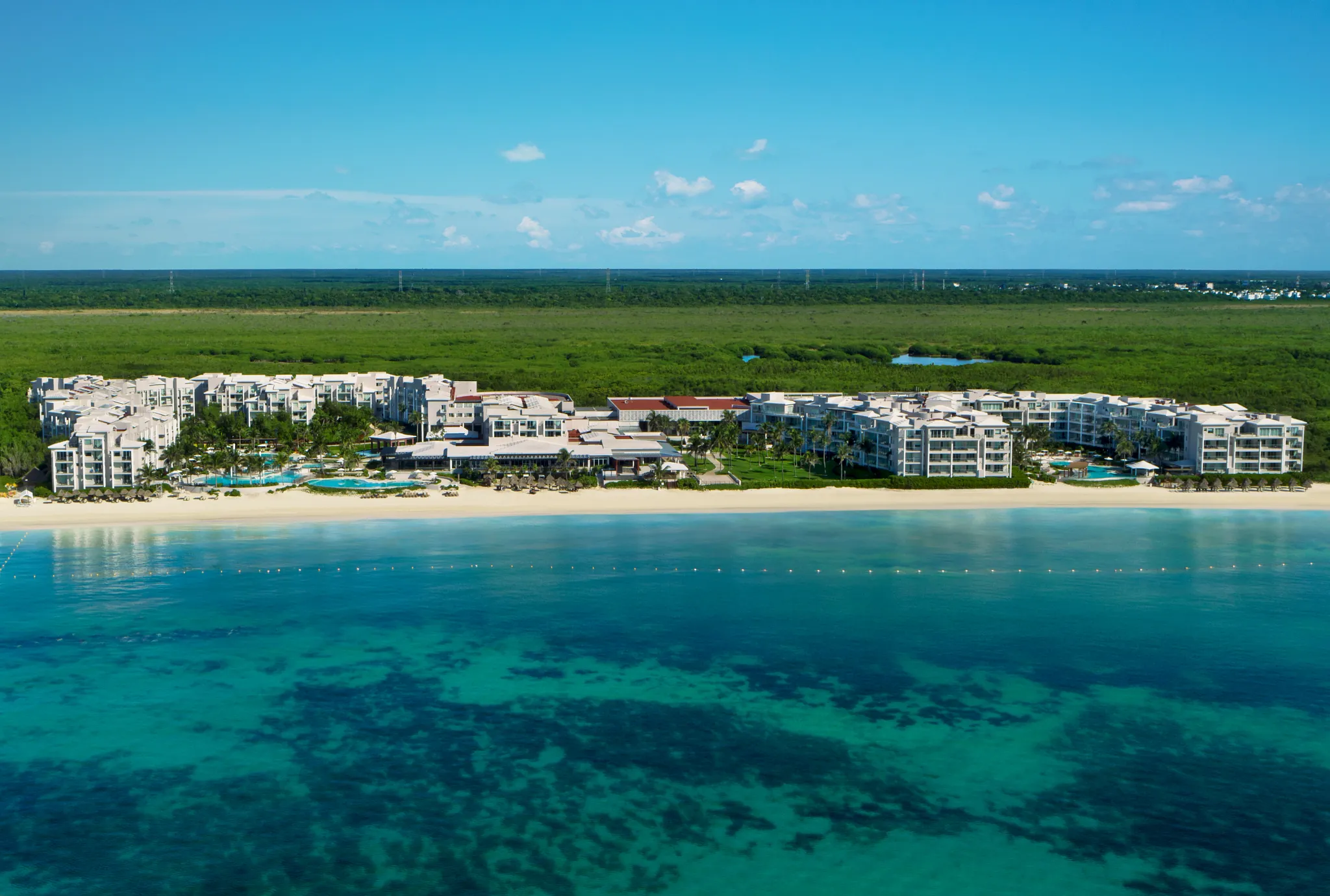Aerial view of Dreams Jade Resort & Spa beachfront property in Puerto Morelos, Mexico.