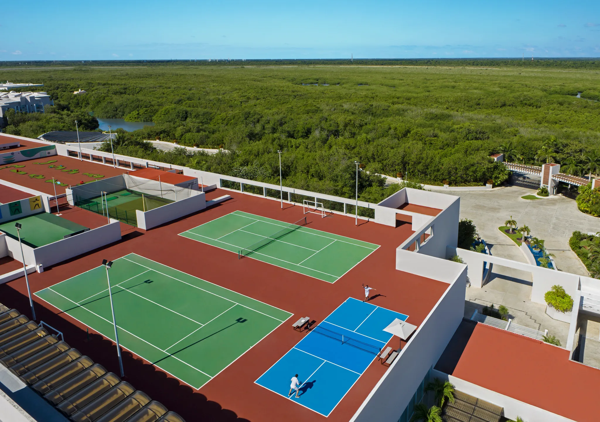 Aerial view of tennis and pickleball courts at Dreams Jade Resort & Spa.