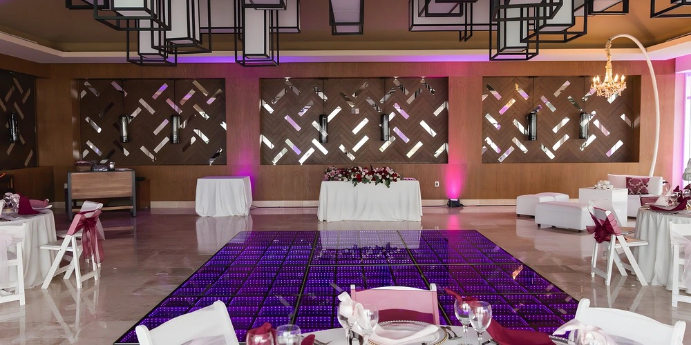 Bamboo Room indoor reception setup with LED dance floor at Dreams Jade Riviera Cancun