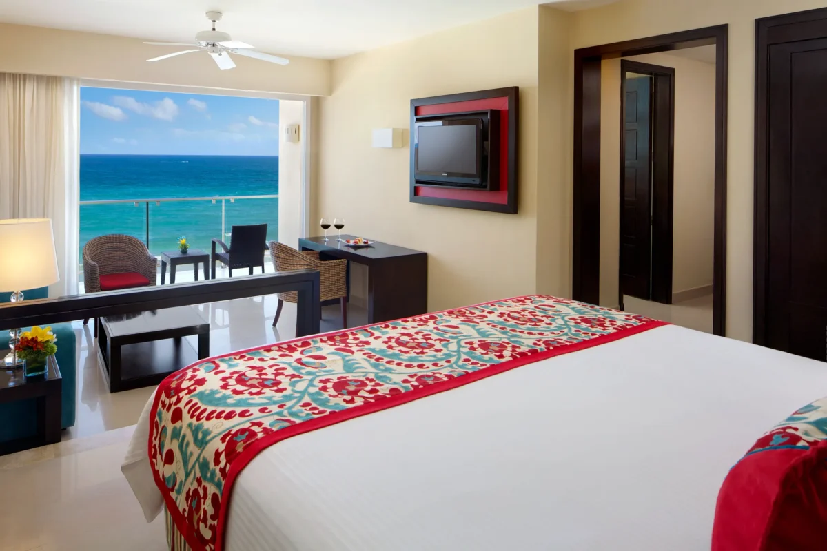 Junior Suite Ocean Front View bedroom with private balcony and Caribbean Sea views at Dreams Jade Resort & Spa.
