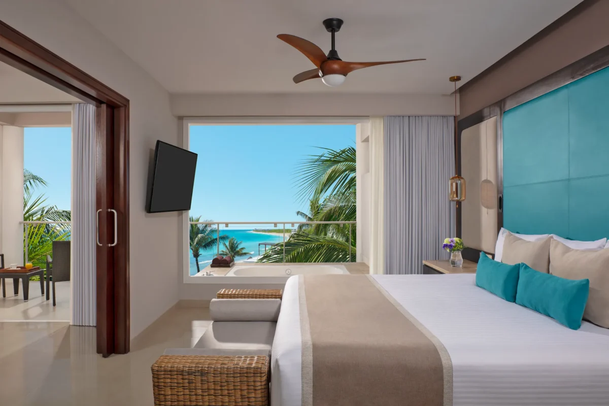 Preferred Club Suite Ocean View king bed with ocean-view balcony at Dreams Jade Resort & Spa.